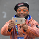 Movie director Spike Lee takes photos of the elite runners during the TCS New York City Marathon Nov. 1, 2015. Lee was the event’s grand marshal.
DON EMMERT/AFP/Getty Images